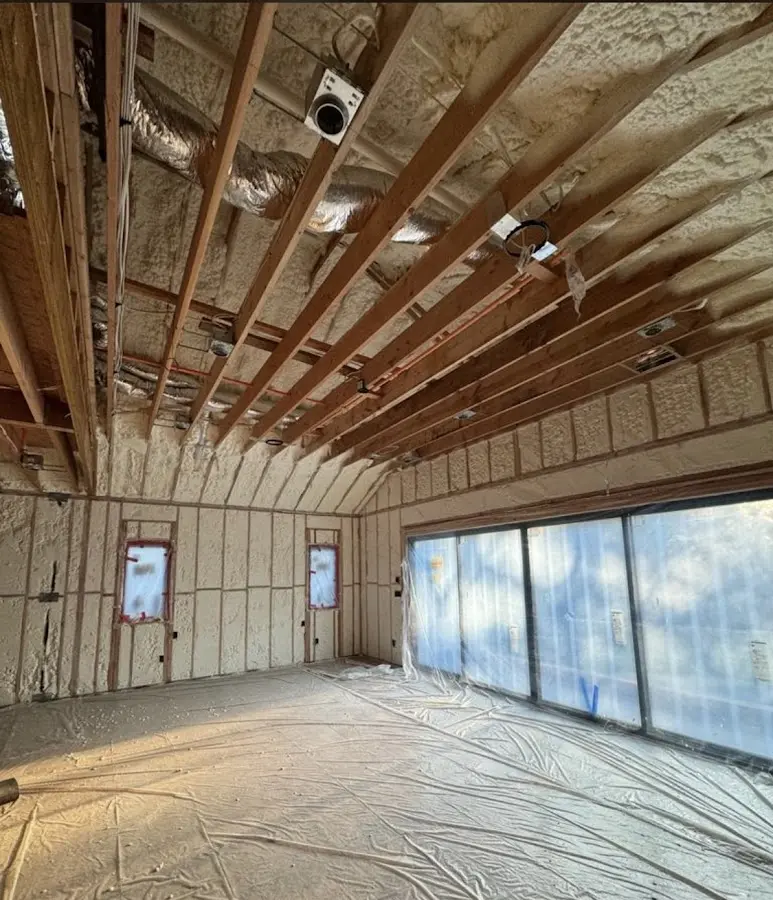 Interior walls and ceiling insulated with spray foam during new construction in Gretna